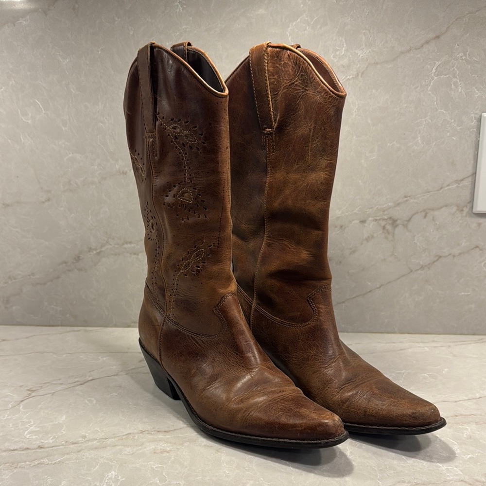 Leather cowboy boots with turquoise cutout details. 
Pointed toe